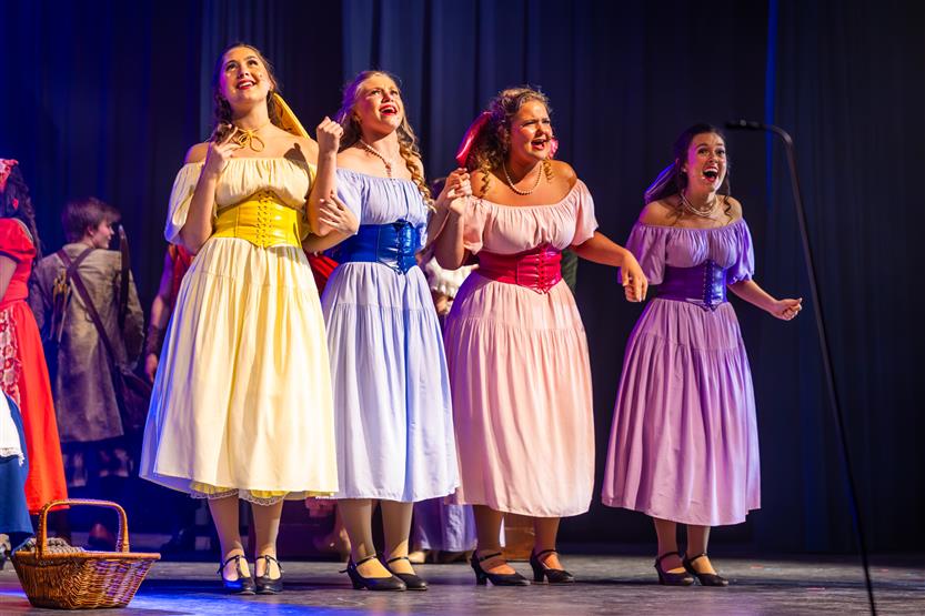 Actors perform onstage